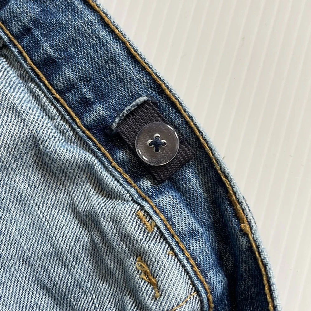 Gymboree flared jeans with gem buttons.  Girls size 7